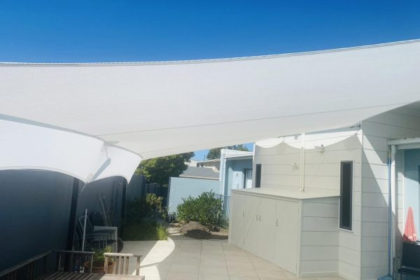 white z1 shade sail with apron over pation white shade sail with privacy apron